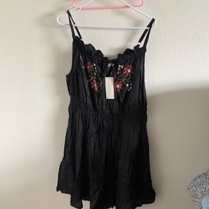 Black dress with stitched flowers